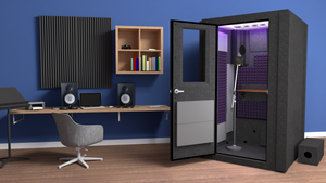 Immaculate WhisperRoom's Voice Over Basic Package - a 4' x 4' single-wall vocal booth adorned with striking purple acoustic treatment, a sleek desk, studio lighting, and an array of features. Set within a cozy home studio, it features a condenser microphone, creating an inviting and professional recording space.