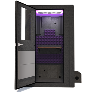 Front view of WhisperRoom's Voice Over Basic Package - a 4' x 4' single-wall vocal booth, thoughtfully equipped with acoustic treatment, a functional desk, studio lighting, and an array of premium features. The left-hinged door is open, revealing the interior accentuated with elegant purple StudioFoam, creating an inviting and professional recording environment.