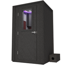 Load image into Gallery viewer, Frontal view of WhisperRoom&#39;s Voice Over Deluxe Package - a 4&#39; x 4&#39; double-wall vocal booth, meticulously designed with acoustic treatment, a functional desk, studio lighting, and a comprehensive range of premium features. The left-hinged door is closed, and the interior is enhanced by sophisticated burgundy StudioFoam, creating an ideal recording environment.
