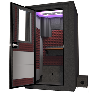 Angled view of the WhisperRoom's Voice Over Deluxe Package - a 4' x 4' double-wall vocal booth, thoughtfully equipped with acoustic treatment, a functional desk, studio lighting, and an array of premium features. The left-hinged door is open, revealing the interior enhanced by sophisticated burgundy StudioFoam, creating an ideal recording atmosphere.