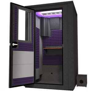 Angled view of the WhisperRoom's Voice Over Deluxe Package - a 4' x 4' double-wall vocal booth, thoughtfully equipped with acoustic treatment, a functional desk, studio lighting, and an array of premium features. The left-hinged door is open, revealing the interior enhanced by elegant purple StudioFoam, creating an ideal recording atmosphere.