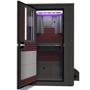 Frontal view of WhisperRoom's Voice Over Deluxe Package - a 4' x 4' double-wall vocal booth, meticulously designed with acoustic treatment, a functional desk, studio lighting, and a comprehensive range of premium features. The left-hinged door is open, revealing the interior enhanced by sophisticated burgundy StudioFoam, creating an ideal recording atmosphere.