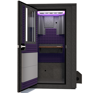 Frontal view of WhisperRoom's Voice Over Deluxe Package - a 4' x 4' double-wall vocal booth, meticulously designed with acoustic treatment, a functional desk, studio lighting, and a comprehensive range of premium features. The left-hinged door is open, revealing the interior enhanced by elegant purple StudioFoam, creating an ideal recording atmosphere.