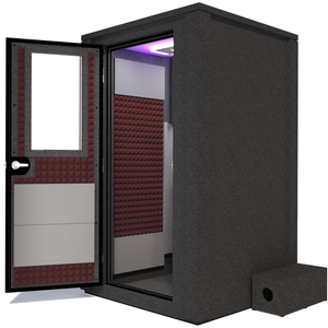 Side view of the WhisperRoom's Voice Over Deluxe Package - a 4' x 4' double-wall vocal booth, thoughtfully equipped with acoustic treatment, a functional desk, studio lighting, and an array of premium features. The left-hinged door is open, revealing the interior enhanced by sophisticated burgundy StudioFoam, creating an ideal recording atmosphere.