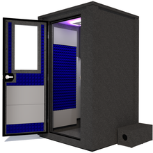 Load image into Gallery viewer, Side view of the WhisperRoom&#39;s Voice Over Deluxe Package - a 4&#39; x 4&#39; double-wall vocal booth, thoughtfully equipped with acoustic treatment, a functional desk, studio lighting, and a comprehensive range of premium features. The left-hinged door is open, revealing the interior accentuated with vibrant blue StudioFoam, creating an ideal recording atmosphere.
