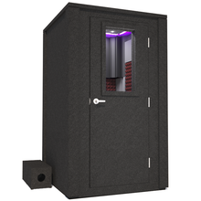 Load image into Gallery viewer, Frontal view of WhisperRoom&#39;s Voice Over Deluxe Package - a 4&#39; x 4&#39; double-wall vocal booth, meticulously designed with acoustic treatment, a functional desk, studio lighting, and a comprehensive range of premium features. The right-hinged door is closed, and the interior is enhanced by sophisticated burgundy StudioFoam, creating an ideal recording environment.
