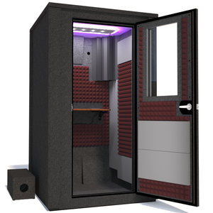 Angled view of WhisperRoom's Voice Over Deluxe Package - a 4' x 4' double-wall vocal booth, meticulously designed with acoustic treatment, a functional desk, studio lighting, and a comprehensive range of premium features. The right-hinged door is open, revealing the interior enhanced by sophisticated burgundy StudioFoam, creating an ideal recording atmosphere.