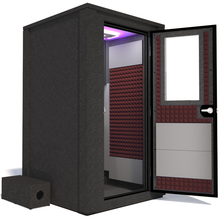 Load image into Gallery viewer, Side view of the WhisperRoom&#39;s Voice Over Deluxe Package - a 4&#39; x 4&#39; double-wall vocal booth, thoughtfully equipped with acoustic treatment, a functional desk, studio lighting, and an array of premium features. The right-hinged door is open, revealing the interior enhanced by sophisticated burgundy StudioFoam, creating an ideal recording atmosphere.
