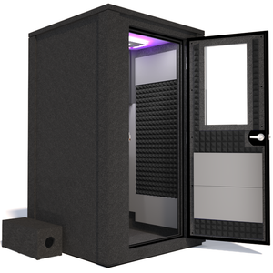 Side view of the WhisperRoom's Voice Over Deluxe Package - a 4' x 4' double-wall vocal booth, thoughtfully equipped with acoustic treatment, a functional desk, studio lighting, and an array of premium features. The right-hinged door is open, revealing the interior enhanced by sophisticated gray StudioFoam, creating an ideal recording atmosphere.
