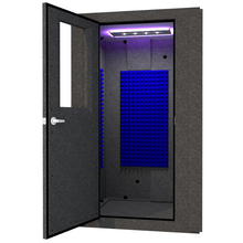 Load image into Gallery viewer, A WhisperRoom MDL 4848 S shown from the front with the door open and a studio light inside. 
